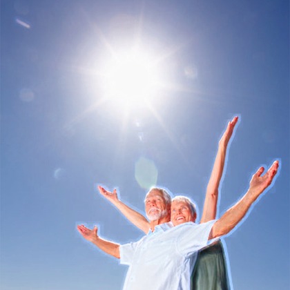 Elderly couple, happy in the sun