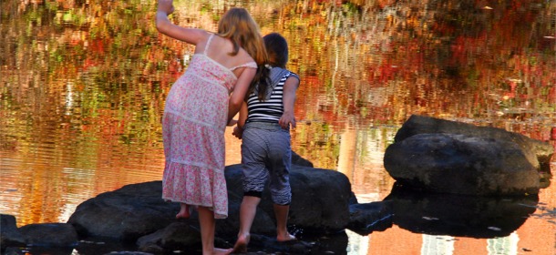 Children playing by water, the way it's supposed to be.